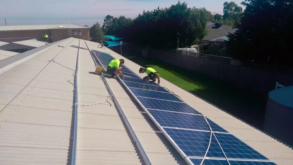 Electricians installing solar panels